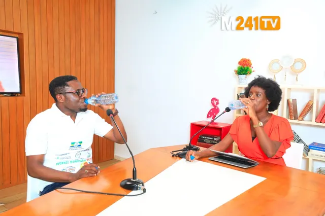 On the M241 TV set, the guest and the journalist drink water during the programme