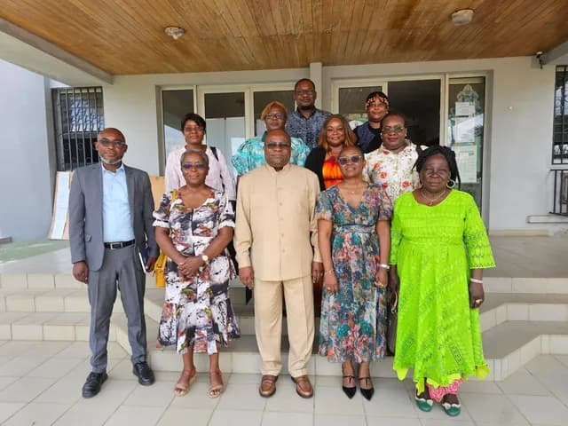 Delegation of doctors and officials in front of a health centre